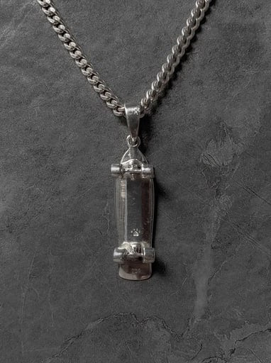 925 sterling silver surfskate pendant with minimalist skateboard design and cubic zirconia wheels – Snow Cat Jewelry
