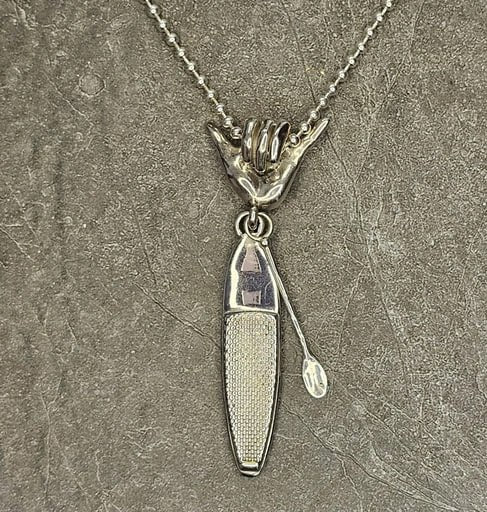 Sterling silver necklace with Shaka hand bail and detailed SUP board pendant with paddle – surf jewelry for ocean lovers by Snow Cat Jewelry