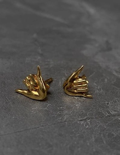 Pair of gold-plated Shaka stud earrings in 925 sterling silver – surf-inspired unisex jewelry by Snow Cat Jewelry