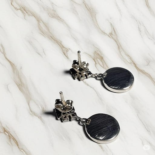 Back side of sterling silver Om and Endless Knot earrings showing 925 stamp and secure stud design – spiritual jewelry by Snow Cat Jewelry