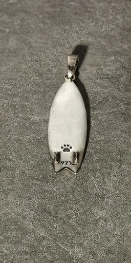 Back side of sterling silver Barong surfboard pendant with white enamel finish and 925 hallmark – handcrafted jewelry by Snow Cat Jewelry
