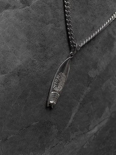 Fish surfboard pendant in 925 sterling silver with detailed coral reef engraving and twin fins – symbolic ocean talisman from Snow Cat Jewelry