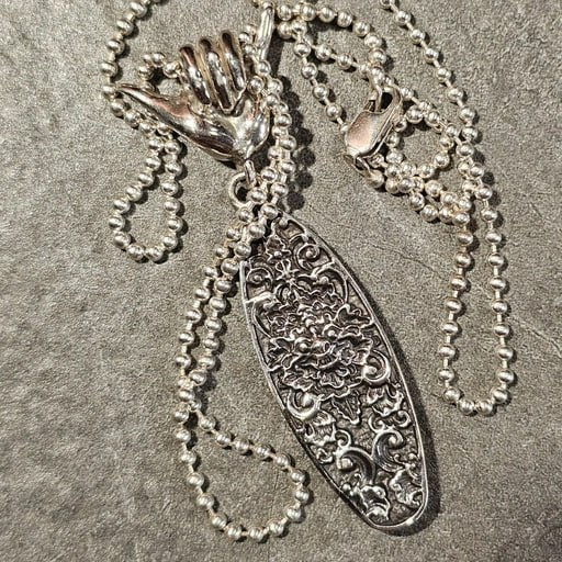 Sterling silver Ocean Spirit necklace with Shaka hand bail and detailed Balinese surfboard pendant on silver ball chain – Snow Cat Jewelry