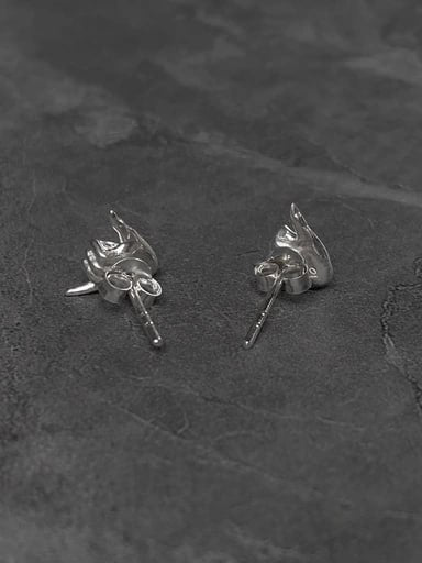 Sterling silver Shaka stud earrings shown from the back on dark slate background – surf-style jewelry by Snow Cat Jewelry